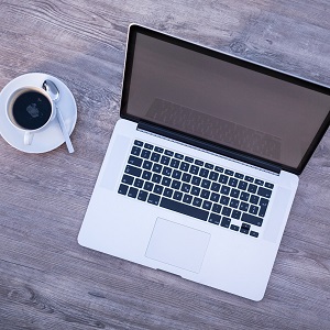 laptop computer and cup of coffee